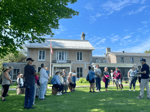 Philip Powell addresses a group of people in front of the Galilee Centre in Gillies Grove, Arnprior, Ontario